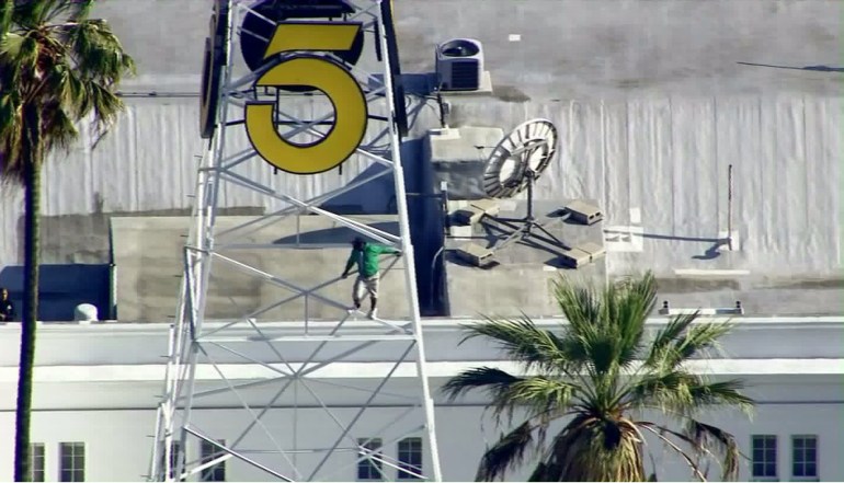 A man climbed the KTLA tower in Hollywood on May 11, 2016. (Credit: KTLA)