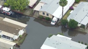 Rain caused flooding on a residential street in Ontario on May 6, 2016. (Credit: KTLA) 