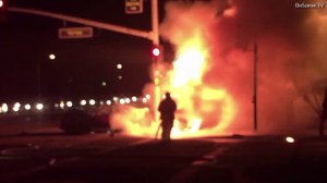 A car burst into flames after a three-car crash in Orange, leaving a person dead on May 12, 2016. (Credit: OnScene TV) 