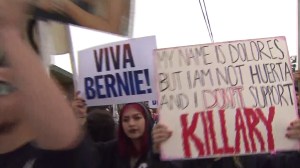 Critics of Hillary Clinton march outside an event for the candidate at East Los Angeles College on May 5, 2016. (Credit: KTLA)