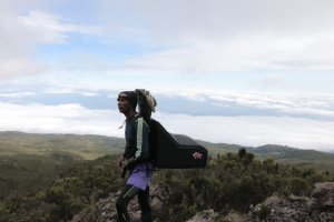 Consea Dissa, a guide who owns Summit Trails, delivered a Pizza Hut pie to the top of Mount Kilimanjaro in a backpack designed by Vesture. (Credit: Consea Dissa/Summit Trails)