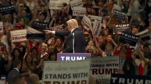 Donald Trump points to his fans after concluding a rally in Anaheim on May 25, 2016. (Credit: KTLA)