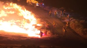 Firefighter set backfires at the end of Steve Kuzj's live shot on June 23, 2016. (Credit: KTLA)