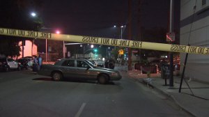 Police and paramedics responded after a vehicle slammed into a taco stand in Boyle Heights on June 26, 2016, leaving one person dead and nine others injured. (Credit: KTLA)