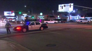 Los Angeles police responded to an intersection in Harbor City after an apparent car-to-car shooting on June 18, 2016. (Credit: KTLA)