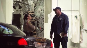 A damaged window is seen at DASH, a Kardashian owned clothing store in Beverly Grove. (Credit: KTLA)