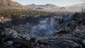 Still smoldering, smoke rises from a destroyed structure after the Erskine Fire after it tore through the Squirrel Mountain Valley neighborhood in Lake Isabella. (Credit: Marcus Yam / Los Angeles Times)