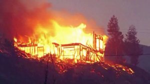 Flames from the Erskine fire tear through a house in the Lake Isabella area. (Credit: KBAK via CNN)