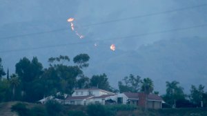 A flare up from the Fish fire can be seen in the hills abouve Duarte early Wednesday morning. (Credit: Irfan Khan/Los Angeles Times)