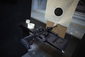 An AR-15 semi-automatic rifle is seen next to a target in the indoor gun range at the National Armory gun store on April 11, 2013, in Pompano Beach, Florida. (Credit: Joe Raedle/Getty Images)