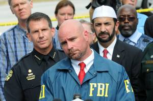 FBI Assistant Special Agent in charge Ron Hopper, center, law enforcement and local community leaders speak during a press conference on June 12, 2016, in Orlando, Florida. (Credit: Gerardo Mora/Getty Images)