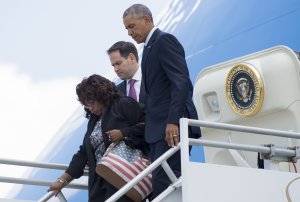President Barack Obama disembarks from Air Force One alongside Sen. Marco Rubio and Rep. Corrine Brown as they arrive at Orlando International Airport in Florida on June 16, 2016. (Credit: Saul Loeb/AFP/Getty Images)