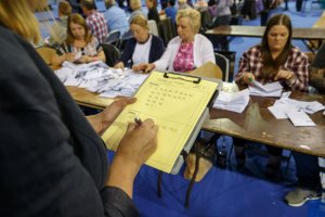 Staff count ballot papers at the Glasgow count centre at the Emirates Arena, Glasgow, Scotland, on June 23, 2016, after polls closed in the referendum on whether the UK will remain or stay in the European Union (EU). Millions of Britons began voting Thursday in a bitterly-fought, knife-edge referendum that could tear up the island nation's EU membership and spark the greatest emergency of the bloc's 60-year history. (Credit: ROBERT PERRY/AFP/Getty Images)