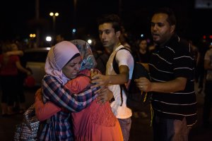 Passengers leave Istanbul Ataturk, Turkey's largest airport, after a suicide bomb attack in the early hours of June 29, 2016, Istanbul, Turkey. (Credit: Defne Karadeniz/Getty Images)
