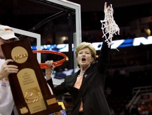 Head coach Pat Summitt of the Tennessee Lady Volunteers celebrates by cutting down the net after Tennessee's 59-46 win against the Rutgers Scarlet Knights to win the 2007 NCAA women's basketball championship game on April 3, 2007, in Cleveland, Ohio. (Credit: Jim McIsaac/Getty Images)