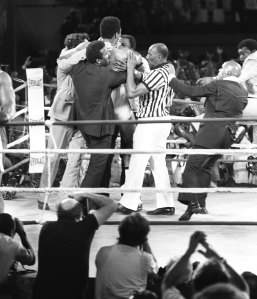 Muhammad Ali's staff and the referee put their arms around Muhammad Ali (Cassius Clay) who just won the title of heavyweight boxing champion match (Rumble in the the Jungle) against his compatriot and titlehoder George Foreman on October 30, 1974 Kinshasa, Congo. (Photo by: AFP/Getty Images)