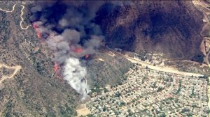 A brush fire burns along a hillside above Duarte on June 20, 2016. (Credit: KTLA) 