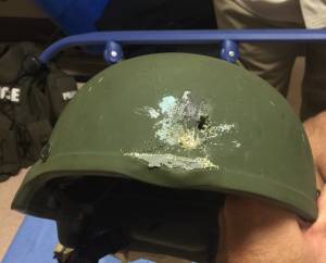 An Orlando Police Officer's helmet was struck during the gunfire in pulse night club in Orlando, Florida. Kevlar helmet saved his life, according to Orlando police. (Credit: Orlando Police)