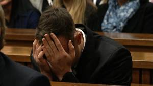 Former Olympic sprinter Oscar Pistorius broke down at a sentencing hearing for the murder of his girlfriend, Reeva Steenkamp, after her cousin told the court that the victim didn't love him. (Credit: POOL)