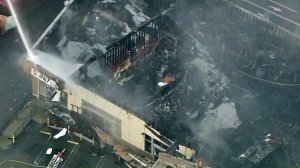 A roof collapsed after a fire broke out in Montecito Heights on July 13, 2016. (Credit: KTLA)