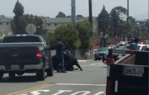 A witness captured video of a possible second suspect being detained in a fatal police shooting in San Diego on July 29, 2016. (Credit: Cesar Cervantes)