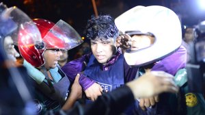 An injured Bangladeshi policeman being assisted after a grenade attack at a restaurant nearby in the early hours of July 2, 2016 in Dhaka, Bangladesh. (Credit: Mahmud Hossain Opu/Getty Images)