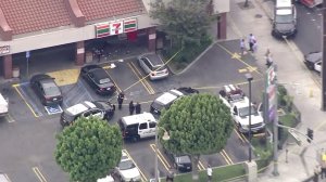 Authorities responded to a strip mall in the city of Bell after a shooting that possibly involved an officer on July 7, 2016. (Credit: KTLA)