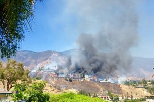 Homes burned in the area of San Bernardino's Skylark Drive on July 2, 2016. (Credit: Nathan Cooke/Twitter)