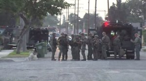Sheriff's deputies respond at the scene of a deputy-involved shooting and pursuit termination in Compton on July 28, 2016. (Credit: KTLA)
