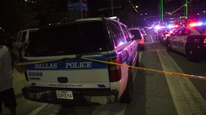 Police cars sit on Main Street in Dallas following the sniper shooting during a protest on July 7, 2016. (Credit: LAURA BUCKMAN/AFP/Getty Images)