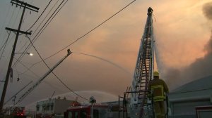 Firefighters battle a commercial structure fire in downtown L.A. on July 23, 2016. (Credit: KTLA)
