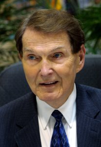 Dr. Tim LaHaye, co-author of the 'Left Behind' series of religious prophecy books, signs a stack of his latest work 'Glorious Appearance', during a book tour stop on April 4, 2004 at the WalMart Super Store in Bossier City, Louisiana. (Credit: Mario Villafuerte/Getty Images)