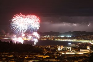 A picture taken on July 14, 2016 shows a flash of lightning as fireworks explode over the French riviera city of Nice, southeastern France, as part of France's annual Bastille Day celebrations. (Credit: VALERY HACHE/AFP/Getty Images)