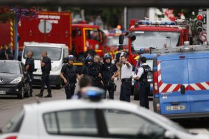 French police officers and fire engine arrive at the scene of a hostage-taking at a church in Saint-Etienne-du-Rouvray, northern France, on July 26, 2016 that left the priest dead. (Credit: CHARLY TRIBALLEAU/AFP/Getty Images)