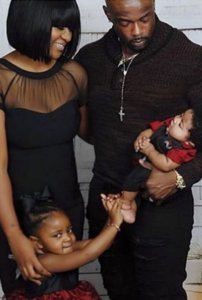 Niya Mann, her husband Lavell, and children Legend and Logan are seen in a photo posted to a GoFundMe page. 