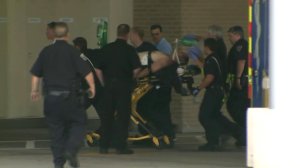 A Ballwin, Missouri, police officer is rushed into the hospital after being shot July 8, 2016. (Credit: KTVI)