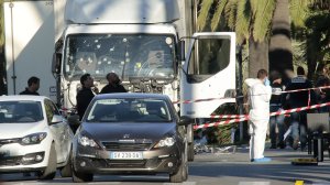 Forensic police investigate a truck at the scene of a terror attack on the Promenade des Anglais on July 15, 2016 in Nice, France. (Credit: Patrick Aventurier/Getty Images)