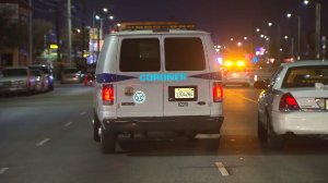 A coroner's van was at the scene of a deadly hit-and-run in North Hills on July 30, 2016. (Credit: KTLA)