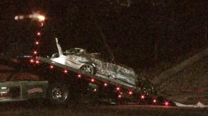 One woman died, and another was critically injured after a convertible went airborne off the freeway and landed on Laurel Canyon Boulevard on July 2, 2016. (Credit: KTLA)