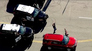 A pursuit driver surrenders in Sherman Oaks after an hour-long pursuit on July 22, 2016. (Credit: KTLA)