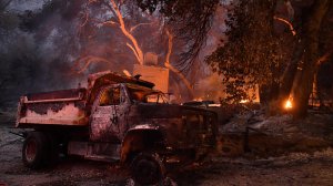 A truck and a house burn along Little Tujunga Canyon Road.(Credit: Wally Skalij / Los Angeles Times)