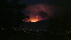 Flames from the Sand Fire burning in Santa Clarita light up the night sky in this image from the the Odyssey Restaurant on July 22, 2016. (Credit: KTLA)