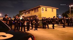 Police are seen in Watts after an officer was shot on July 25, 2016. (Credit: OnScene.TV)