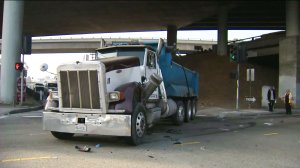 A dump truck is seen after a crash involving a Metro bus on Aug. 31, 2016. (Credit: KTLA)