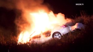 A car erupts in flames after the driver lost control in the Cajon Pass on Aug. 26, 2016. (Credit: OnScene.TV)