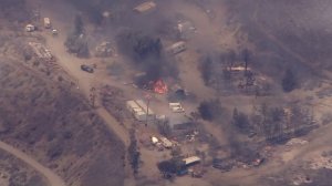 Structures burn in the Swarthout Canyon area during the Blue Cut Fire on Aug. 16, 2016. (Credit: KTLA)