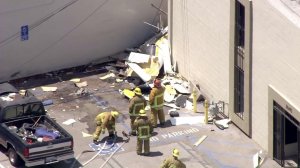 A plane crashed into a building near the Van Nuys Airport on Aug. 2, 2016. (Credit: KTLA)