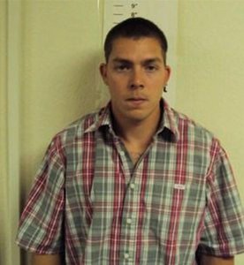 Daniel Rowe is seen in a booking photo after he allegedly stabbed an interracial couple in Olympia Washington on Aug. 16, 2016.