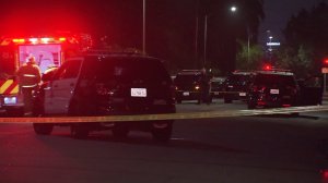 LAPD officials investigate the scene of an officer-involved shooting in East Hollywood on Aug. 16, 2016. (Credit: KTLA)