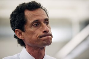 Anthony Weiner, a leading candidate for New York City mayor, stands with his wife Huma Abedin during a press conference on July 23, 2013 in New York City. (Credit: John Moore/Getty Images)